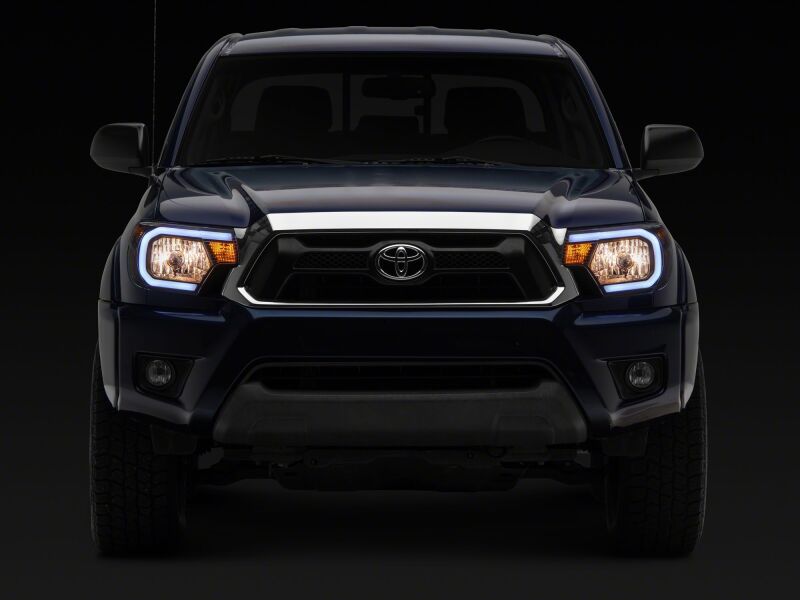 Raxiom 12-15 Toyota Tacoma Axial Series Headlights/Seq LED Bar- Black- Clear Lens