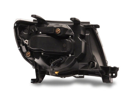 Raxiom 05-11 Toyota Tacoma Axial Series Switchback Projector Headlights- Black Housing- Clear Lens