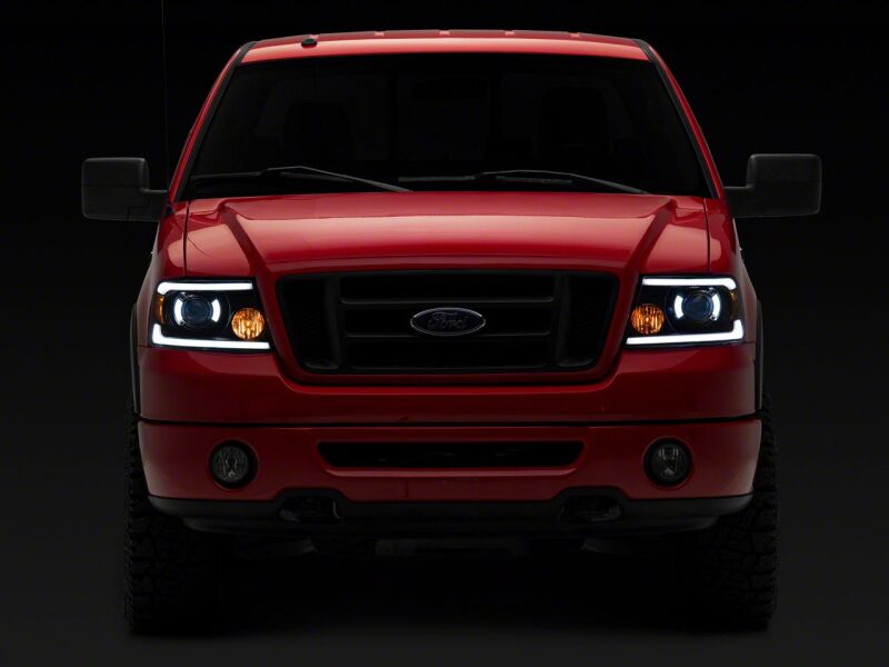 Raxiom 04-08 Ford F-150 Axial Series Projector Headlights with LED Bar- Black Housing- Clear Lens