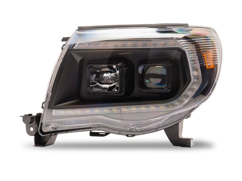 Raxiom 05-11 Toyota Tacoma Axial Series Switchback Projector Headlights- Black Housing- Clear Lens