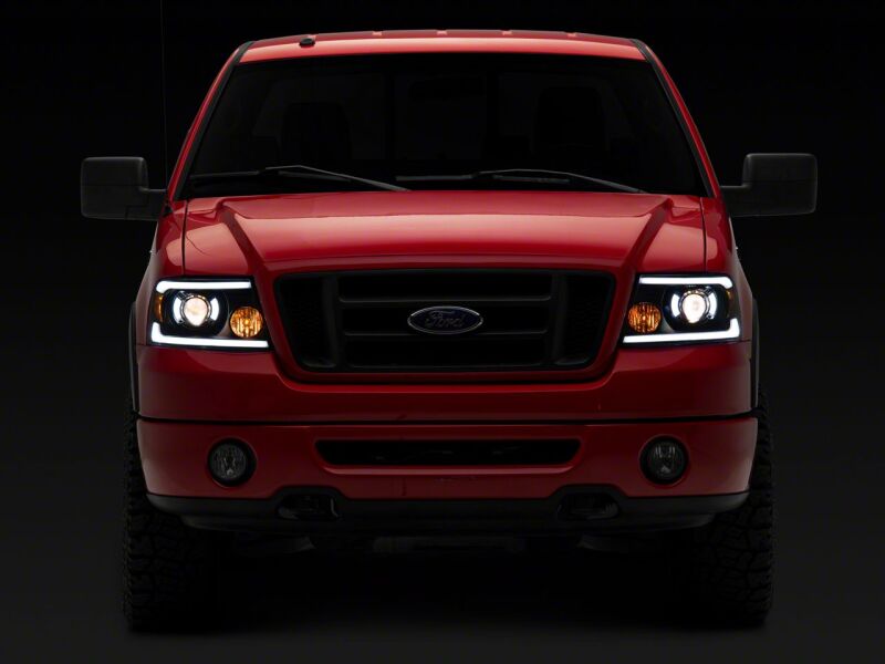 Raxiom 04-08 Ford F-150 Axial Series Projector Headlights with LED Bar- Black Housing- Clear Lens