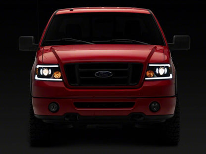 Raxiom 04-08 Ford F-150 Axial Series Projector Headlights with LED Bar- Black Housing- Clear Lens
