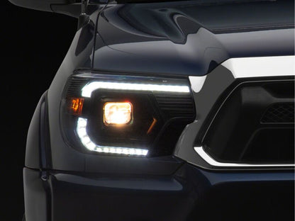 Raxiom 12-15 Toyota Tacoma Axial Series Switchback Projector Headlights- Black Housing- Clear Lens
