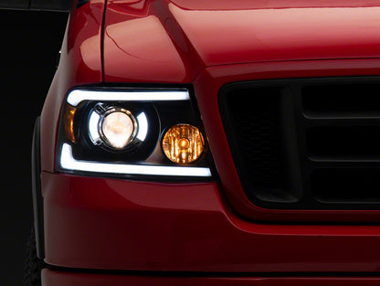 Raxiom 04-08 Ford F-150 Axial Series Projector Headlights with LED Bar- Black Housing- Clear Lens