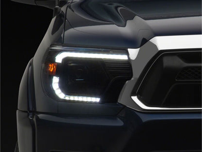 Raxiom 12-15 Toyota Tacoma Axial Series Switchback Projector Headlights- Black Housing- Clear Lens