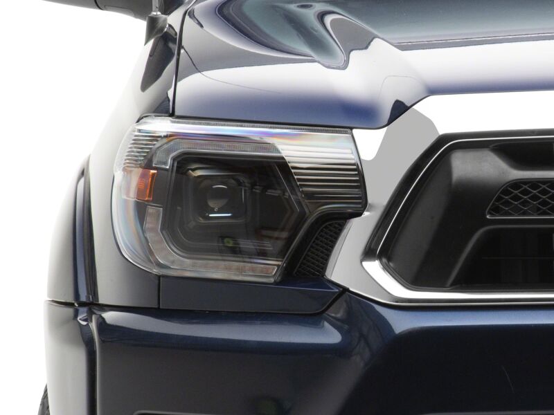 Raxiom 12-15 Toyota Tacoma Axial Series Switchback Projector Headlights- Black Housing- Clear Lens