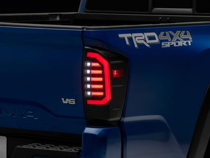 Raxiom 16-23 Toyota Tacoma Axial Series LED Tail Lights- Black Housing- Smoked Lens