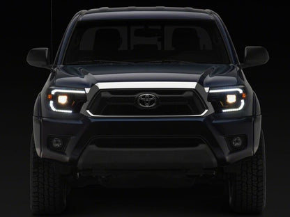 Raxiom 12-15 Toyota Tacoma Axial Series Switchback Projector Headlights- Black Housing- Clear Lens