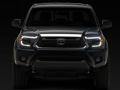 Raxiom 12-15 Toyota Tacoma Axial Series Switchback Projector Headlights- Chrome- Clear Lens